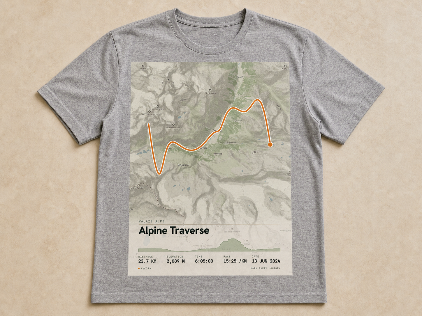 The Route Tee, a folded heather cotton tee with the route as a small chest badge